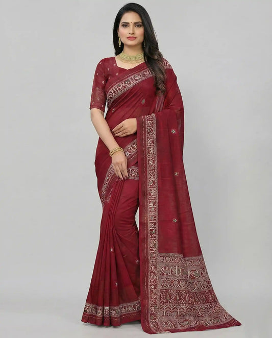 A professional model wearing a deep maroon traditional saree featuring white elephant and bird motifs on the pallu and an ornate border, designed by Sherly's Attire.