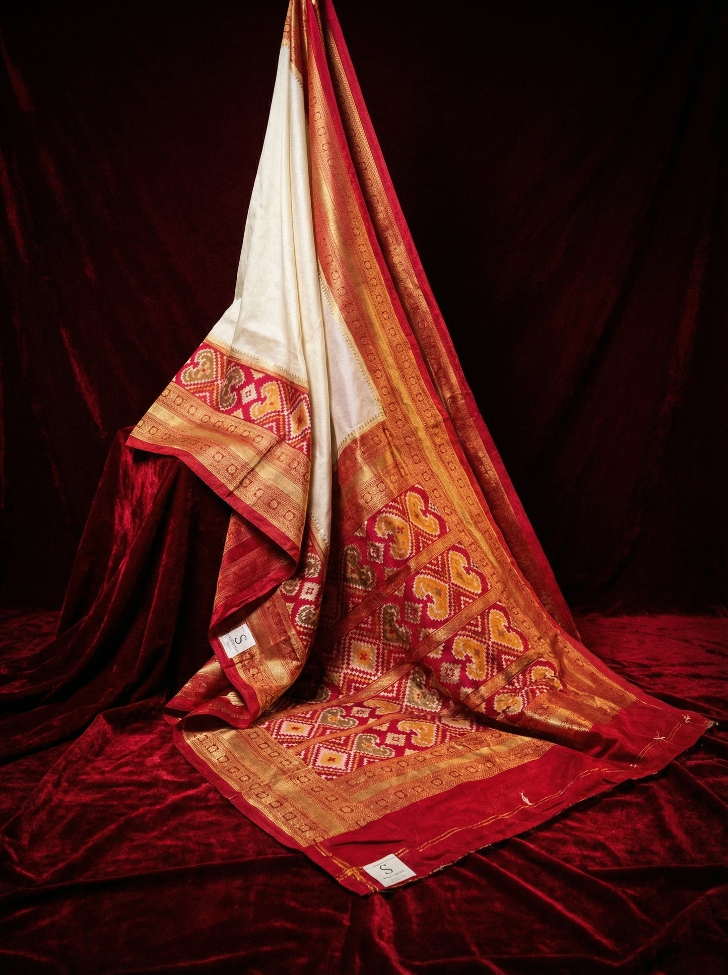 The Heritage Ivory Fusion – Off-White & Crimson Patola Silk Saree